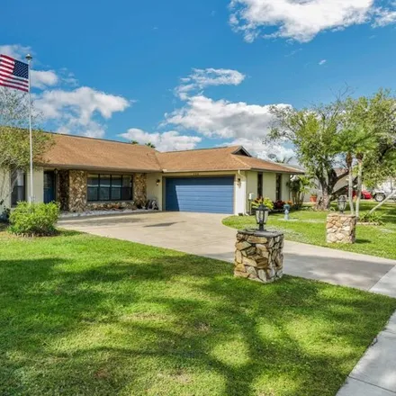 Buy this 3 bed house on 148 Northwest Curtis Street in Port Saint Lucie, FL 34983