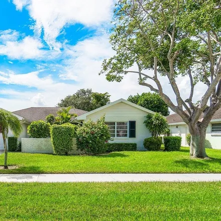 Buy this 3 bed house on 10813 Greentrail Drive South in Palm Beach County, FL 33436