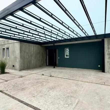 Buy this 4 bed house on Juan Mermoz in Partido de Escobar, B1625 AAF Belén de Escobar