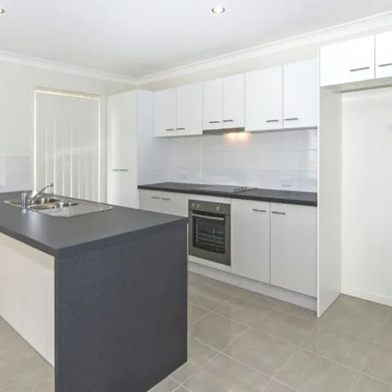 Rent this 4 bed apartment on Kurrawa Crescent in Glenvale QLD 4350, Australia