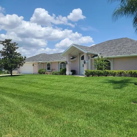Buy this 4 bed house on 2357 Se Luau Ave in Port Saint Lucie, Florida