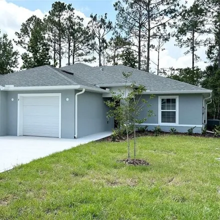 Rent this 3 bed house on 132 Slumber Meadow Trail in Palm Coast, FL 32164