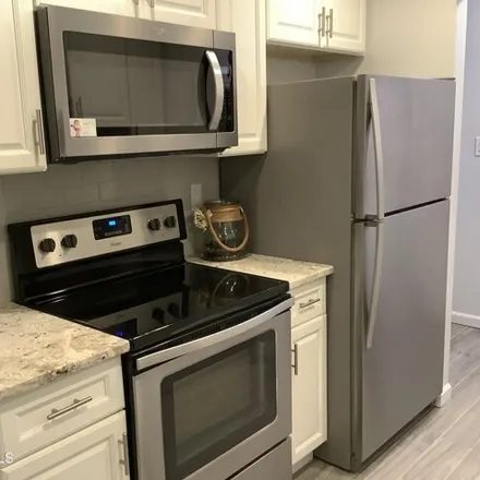 Rent this 2 bed house on 97 Arrowood Rd Unit E in Manalapan, New Jersey