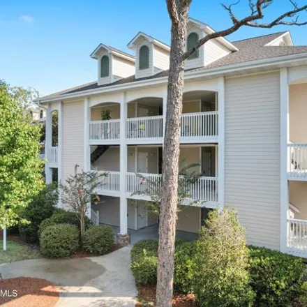 Rent this 2 bed condo on 1333 Club Villas Drive in St. James, NC 28461