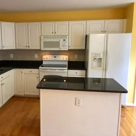 Rent this 4 bed townhouse on 9021 Coriander Circle in Georgetown South, Manassas