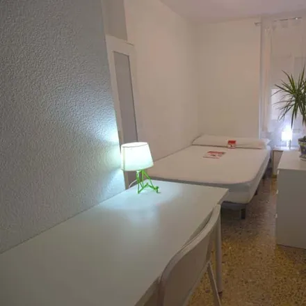 Rent this 4 bed room on Carrer del Mestre Valls in 46022 Valencia, Spain