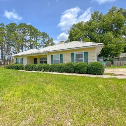 Rent this 3 bed house on 25488 Southwest 2 Avenue in Newberry, FL 32669