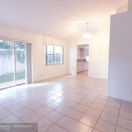 Rent this 3 bed apartment on 3698 Moroccan Way in Pompano Beach, FL 33069