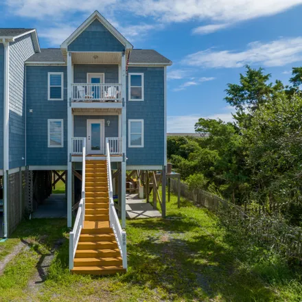 Buy this 4 bed townhouse on 208 Oyster Lane in North Topsail Beach, NC 28460