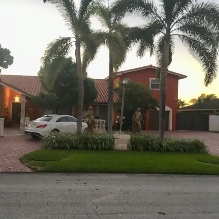 Rent this 6 bed house on 19510 West Oakmont Drive in Country Club, Hialeah