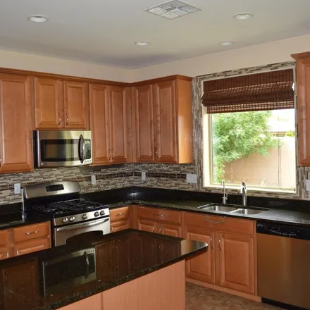 Rent this 4 bed apartment on 1135 East Furness Drive in Gilbert, AZ 85297