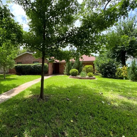 Rent this 4 bed house on 3102 Burning Tree Lane in Garland, TX 75042