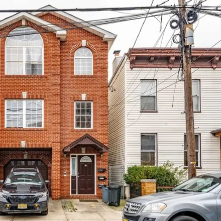 Buy this 8 bed house on 66 Webster Avenue in Jersey City, NJ 07307