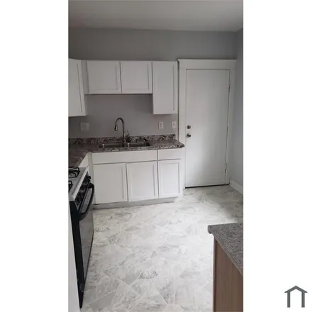 Rent this 2 bed townhouse on 13808 Woodward Avenue in Highland Park, MI 48203