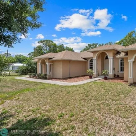 Buy this 4 bed house on 13294 56th Place North in Palm Beach County, FL 33411