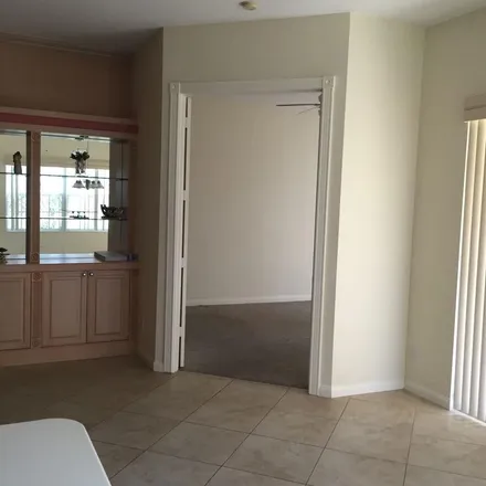 Rent this 3 bed apartment on Hammock Circle in Delray Beach, FL 33445