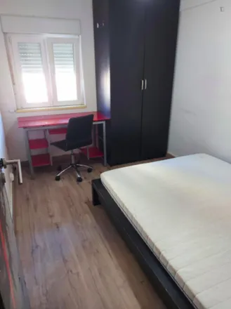 Rent this 4 bed room on Rua Cidade da Praia LT 367 in 1800-119 Lisbon, Portugal
