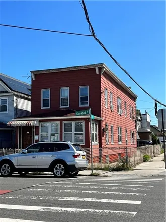 Buy this 8 bed townhouse on 9802 Glenwood Road in New York, NY 11236
