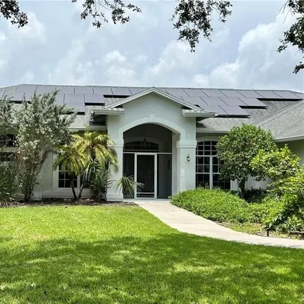 Buy this 5 bed house on 9339 Windlake Dr in Fort Myers, Florida