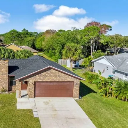 Buy this 3 bed house on 1276 Gust Row Avenue Northwest in Palm Bay, FL 32907