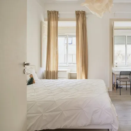 Rent this 4 bed room on Rua Carvalho Araújo 90 in 1900-140 Lisbon, Portugal