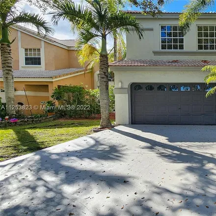 Buy this 4 bed house on 5587 Northwest 106th Drive in Kensington Manor, Coral Springs