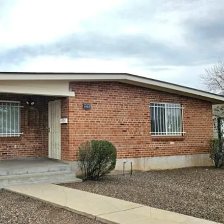 Rent this 3 bed house on 1668 East 9th Street in Tucson, AZ 85719