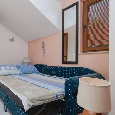 Rent this 4 bed house on 21410 Općina Postira