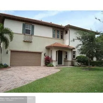 Rent this 3 bed townhouse on 6013 Northwest 118th Drive in Heron Bay South, Coral Springs