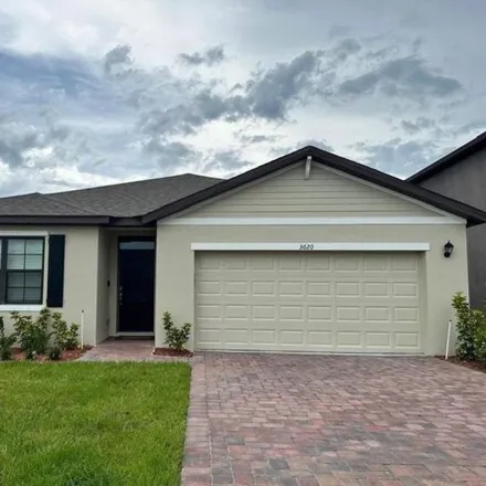 Rent this 4 bed house on Foggy Mist Road Southeast in Palm Bay, FL