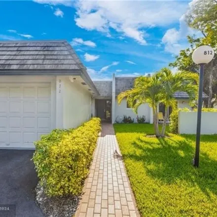 Rent this 3 bed house on Cypress Course in 1011 East Cypress Lane, Pompano Beach