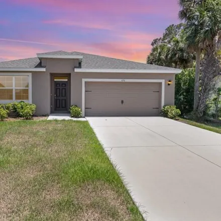 Buy this 4 bed house on 654 Airoso Road Southeast in Palm Bay, FL 32909