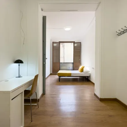 Rent this 4 bed room on Carrer Nou de la Rambla in 106, 08001 Barcelona