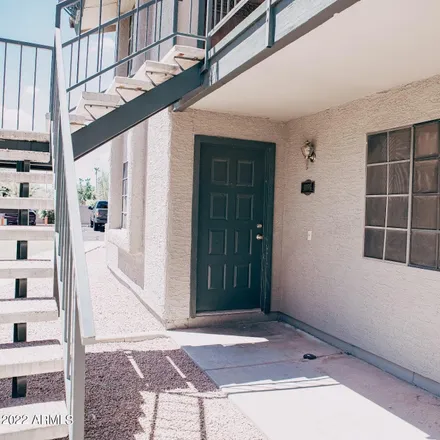 Buy this 2 bed townhouse on Woodglen Square 2 Condominiums in 533 West Guadalupe Road, Mesa
