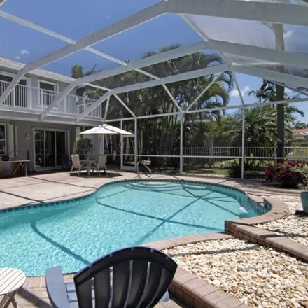 Buy this 4 bed house on 1739 Corsica Drive in Wellington, FL 33414