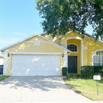 Rent this 4 bed house on 230 Casterton Circle in Polk County, FL 33897