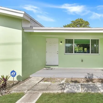 Rent this 3 bed house on 910 Phippen Waiters Rd in Dania Beach, Florida