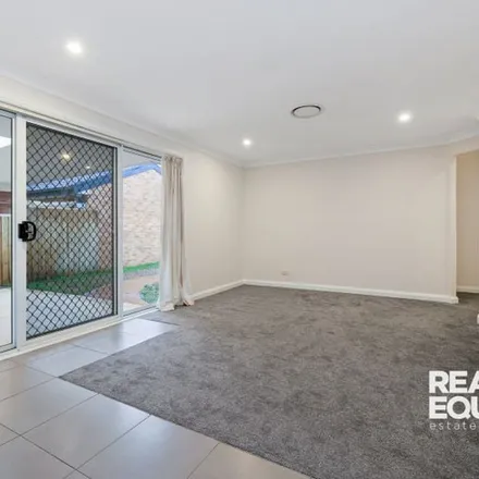 Rent this 4 bed apartment on 11 Timbara Court in Wattle Grove NSW 2173, Australia