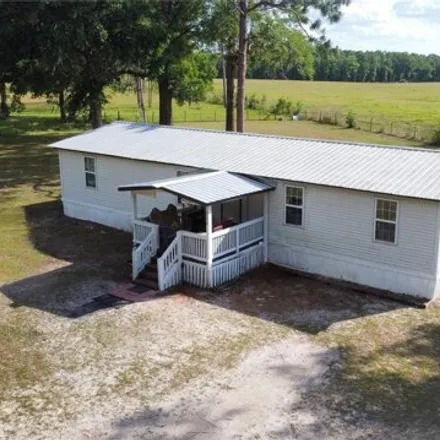 Buy this studio apartment on 9556 Sw Us Highway 27 in Fort White, Florida