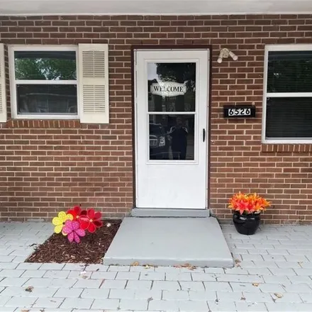 Buy this 4 bed townhouse on 6536 Pasteur Court in Rosemont, Norfolk