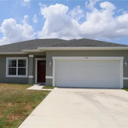 Rent this 4 bed house on 721 Parrot Court in Polk County, FL 34759