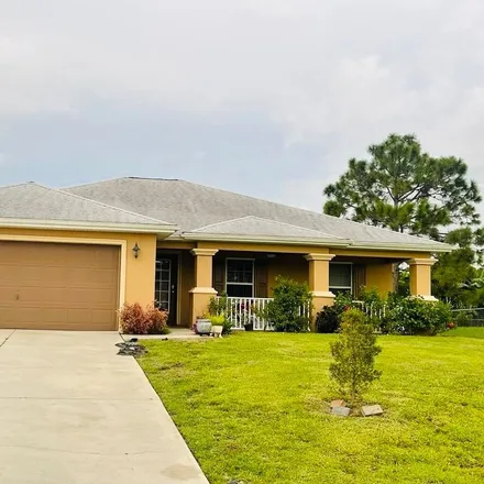 Buy this 3 bed house on 1118 Champion Avenue in Lehigh Acres, FL 33971