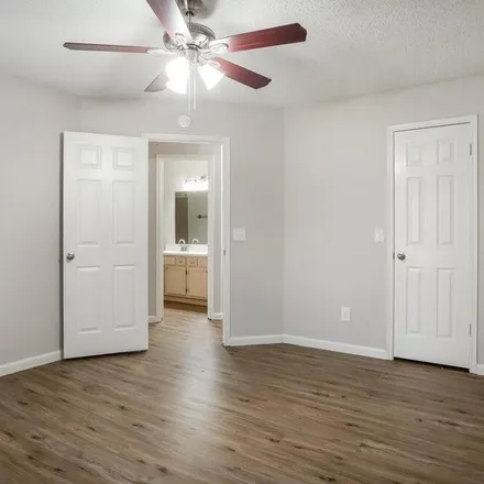 Rent this 4 bed apartment on 9030 Stoney Bend Drive in Harris County, TX 77379