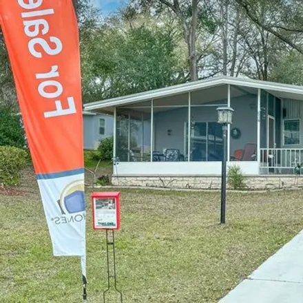 Buy this studio apartment on 307 Cypress Curve in Lady Lake, FL 32159