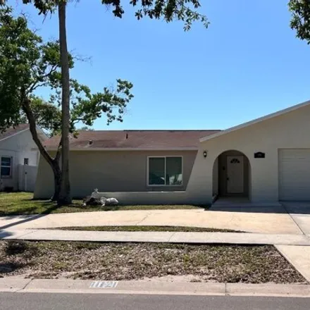 Buy this 4 bed house on 11169 Peppertree Lane in Bayonet Point, FL 34668