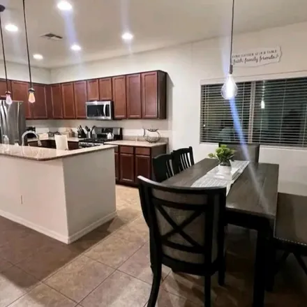 Rent this 3 bed apartment on 1046 West Empress Tree Avenue in San Tan Valley, AZ 85140