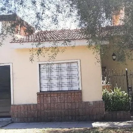 Buy this 4 bed house on 1008 - Aviador Curtis 6904 in Partido de Tres de Febrero, 1687 Ciudad Jardín Lomas del Palomar