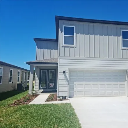 Rent this 3 bed house on Sharp Pummelo Alley in Orange County, FL