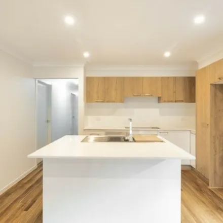 Rent this 4 bed apartment on Farmgate Crescent in Calderwood NSW 2527, Australia