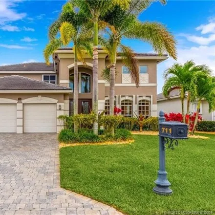 Buy this 4 bed house on 711 Sw River Bend Cir in Stuart, Florida